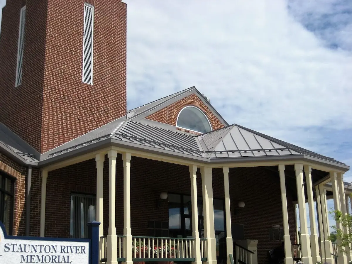Skilled roofing craftsmen working on a residential roof in Oildale